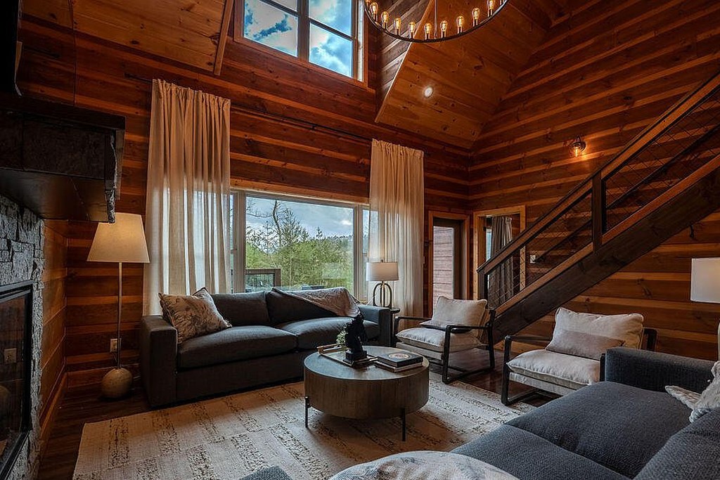 Seating turned toward the glazing with the ridgeline beyond