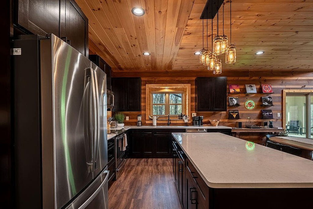 Range wall and stainless appliances against the log envelope